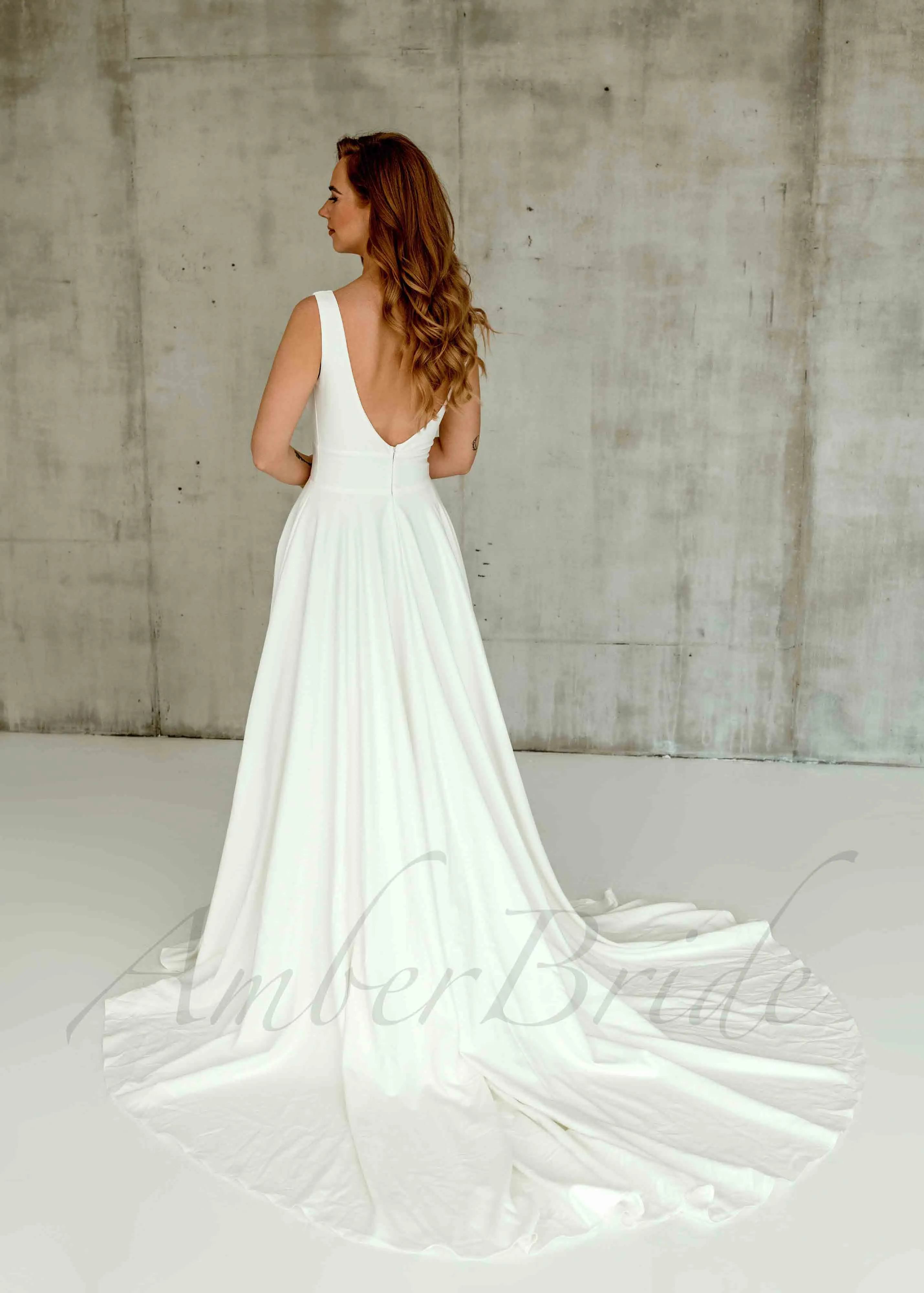 Minimalistic A Line Satin Wedding Dress with Deep V Neck and Backless Design